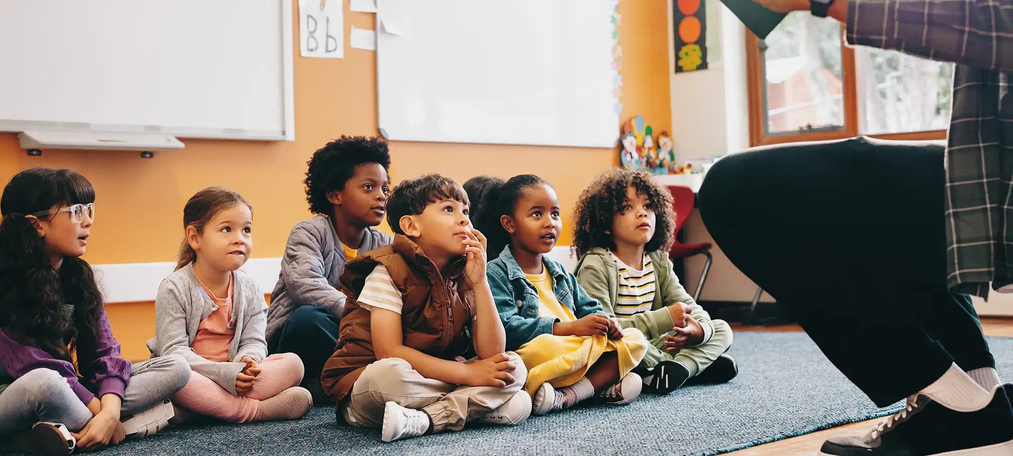 indigo-community-schools-kids-sitting-in-classroom-with-teacher